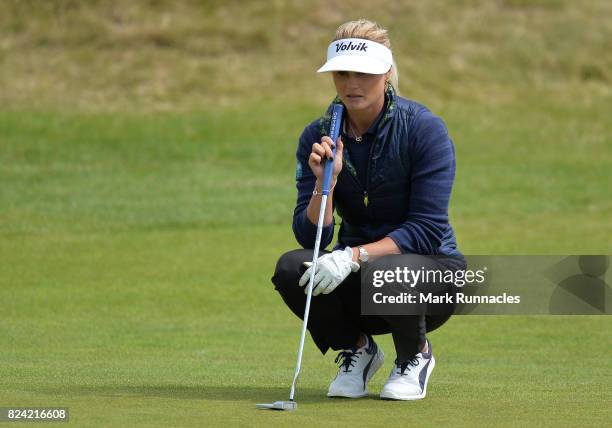 Carly Booth of Scotland lines up a putt at the 1st hole during the third day of the Aberdeen Asset Management Ladies Scottish Open at Dundonald Links...