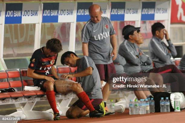 Shoma Doi of Kashima Antlers receives medical treatment during the J.League J1 match between Kashima Antlers and Ventforet Kofu at Kashima Soccer...