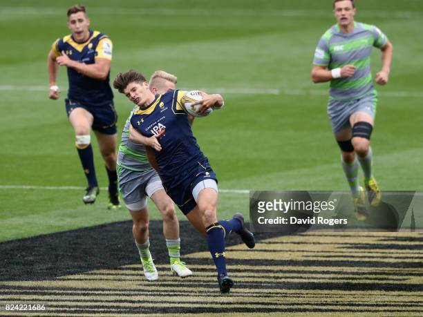 Ben Howard of Worcester Warriors is tackled in the match against Newcastle Falcons during the Singha Premiership Rugby 7s Series Day Two at...