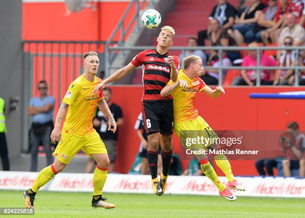 Sebastian Polter of 1.FC Union Berlin, Alfredo Morales of FC Ingolstadt 04 and Simon Hedlund of 1 FC Union Berlin during the game between FC...