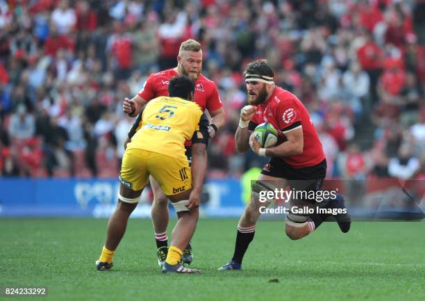 Lourens Erasmus and Akker van der Merwe of Lions in action with Sam Lousi of Hurricanes during the Super Rugby, Semi Final match between Emirates...
