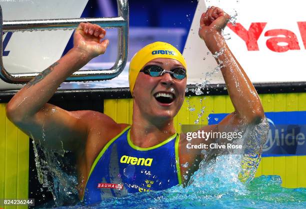 Sarah Sjostrom of Sweden celebrates after winning the gold medal during the Women's 50m Butterfly final on day sixteen of the Budapest 2017 FINA...