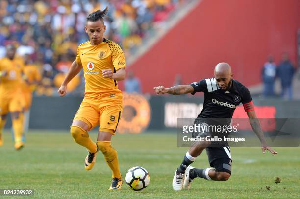 Gustavo Paez and Oupa Manyisa during the Carling Black Label Champion Cup match between Orlando Pirates and Kaizer Chiefs at FNB Stadium on July 29,...