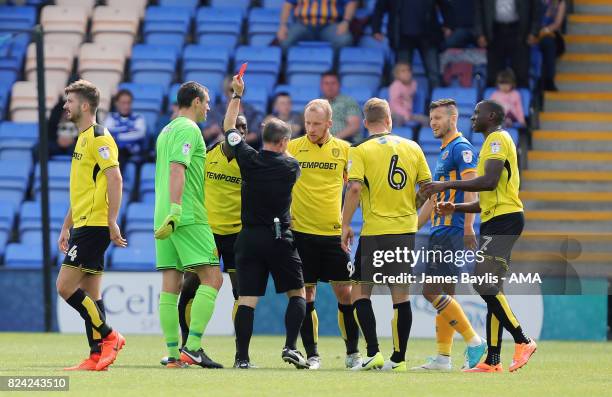 Marvin Sordell of Burton Albion is sent off by referee Rob Lewis following a challenge on Abu Ogogo of Shrewsbury Town during the Pre- Season...