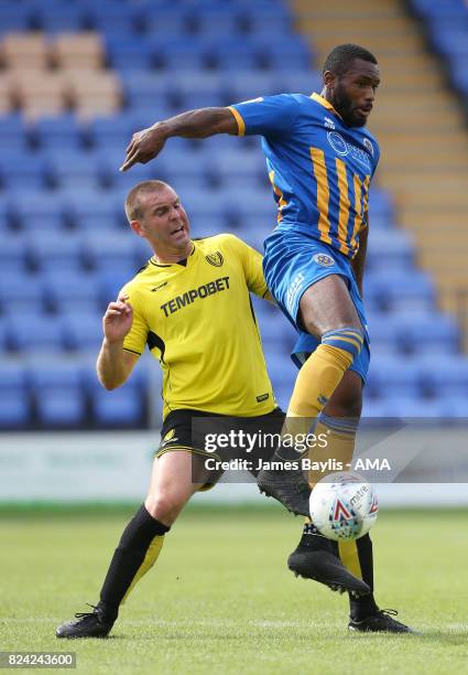 Jake Buxton of Burton Albion and Lenell John-Lewis of Shrewsbury Town during the Pre-Season Friendly between Shrewsbury Town and Burton Albion at the...