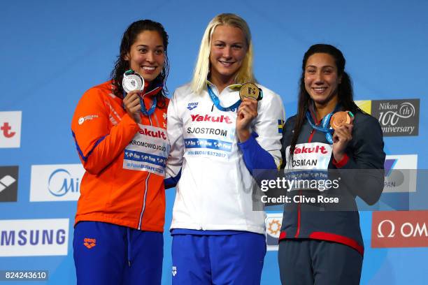 Silver medalist Ranomi Kromowidjojo of the Netherlands, gold medalist Sarah Sjostrom of Sweden and bronze medalist Farina Osman of Egypt pose with...