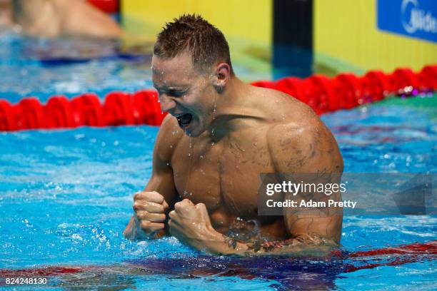 Caeleb Remel Dressel of the United States celebrates winning the gold medal during the Men's 100m Butterfly final on day sixteen of the Budapest 2017...