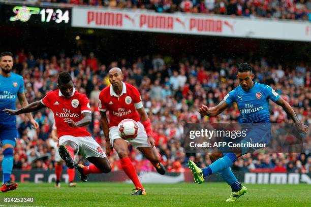 Arsenal's English midfielder Theo Walcott shoots over the bar during the pre-season friendly football match between Arsenal and Benfica at The...