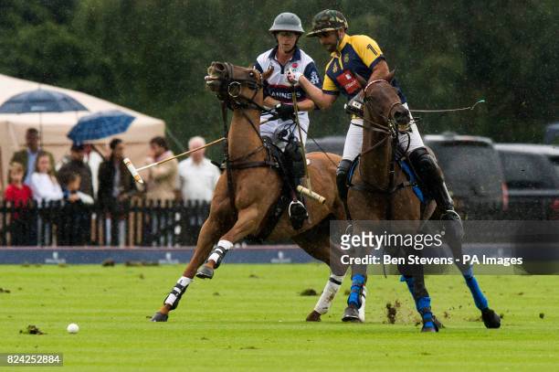 England and Commonwealth polo players during the Royal Salute Coronation Cup polo at Windsor Great Park in Surrey.