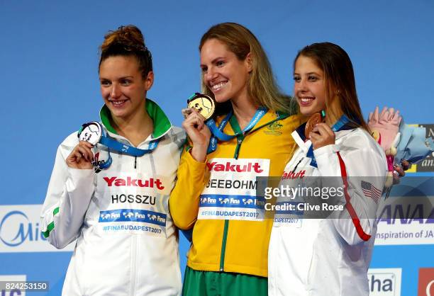 Silver medalist Katinka Hosszu of Hungary, gold medalist Emily Seebohm of Australia and bronze medalist Kathleen Baker of the United States pose with...