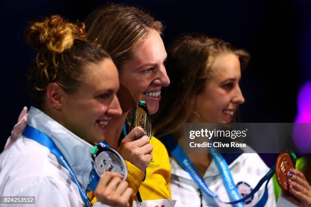 Silver medalist Katinka Hosszu of Hungary, gold medalist Emily Seebohm of Australia and bronze medalist Kathleen Baker of the United States pose with...