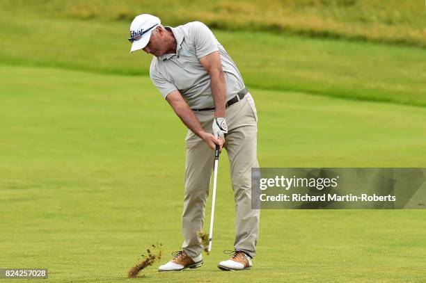 David Mckenzie of Australia hits his second shot on the 2nd hole during the third round of the Senior Open Championship presented by Rolex at Royal...