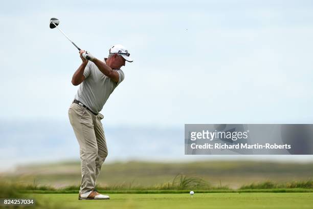 David Mckenzie of Australia tees off on the 3rd hole during the third round of the Senior Open Championship presented by Rolex at Royal Porthcawl...