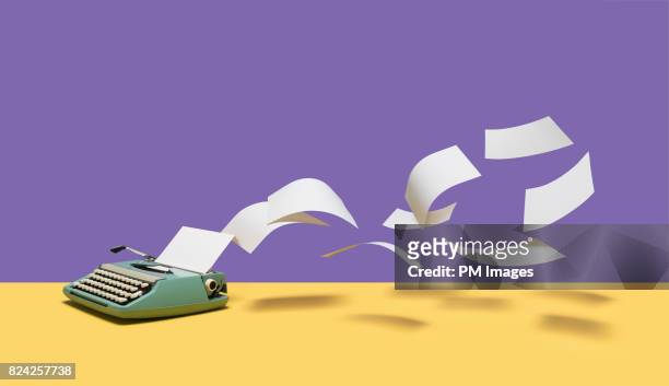 paper flying out of manual typewriter - flying stock pictures, royalty-free photos & images