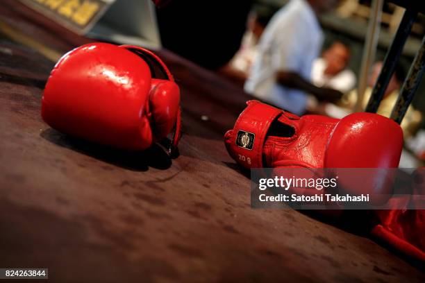 Boxing gloves on the CTN kick boxing ring after a match.