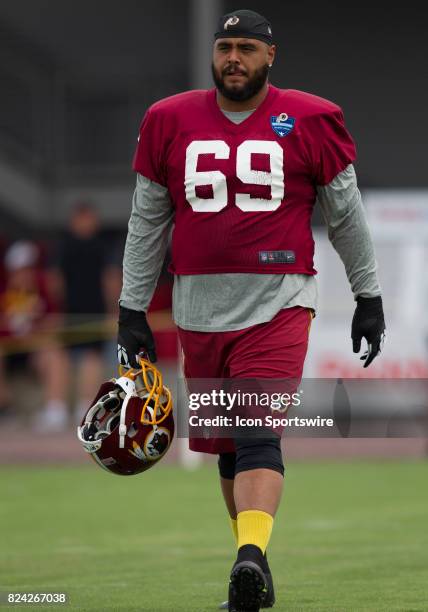 Washington Redskins defensive tackle A.J. Francis walks onto the field prior to practice during day one of Redskins training camp at Bon Secours...
