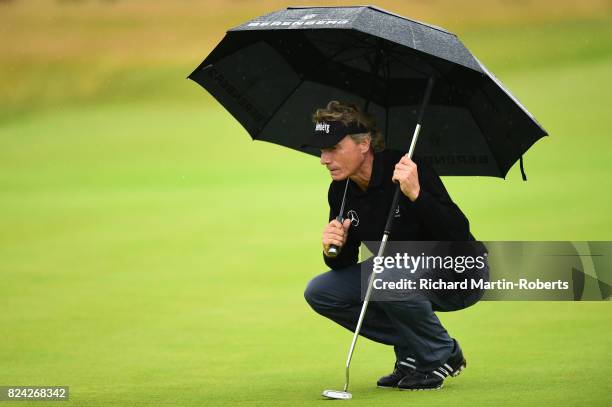 Bernhard Langer of Germany lines up a putt on the 18th green during the third round of the Senior Open Championship presented by Rolex at Royal...