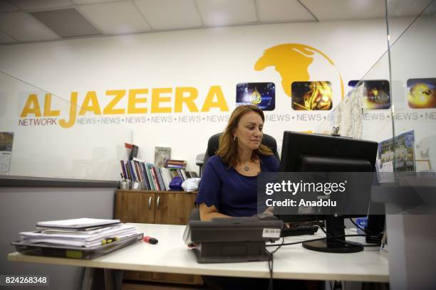 Employees of Qatar based news network and TV channel Al-Jazeera are seen on their duty at the Jerusalem office where on July 29, 2017. Prime Minister...