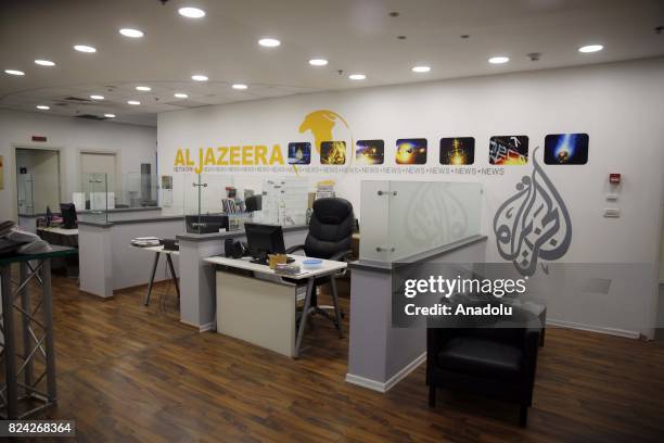 View of Qatar based news network and TV channel Al-Jazeera are seen on their duty at the Jerusalem office where on July 29, 2017. Prime Minister...