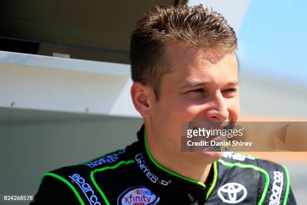Dakoda Armstrong, driver of the WinField United Toyota, stands on the grid during qualifying for the NASCAR XFINITY Series US Cellular 250 Presented...