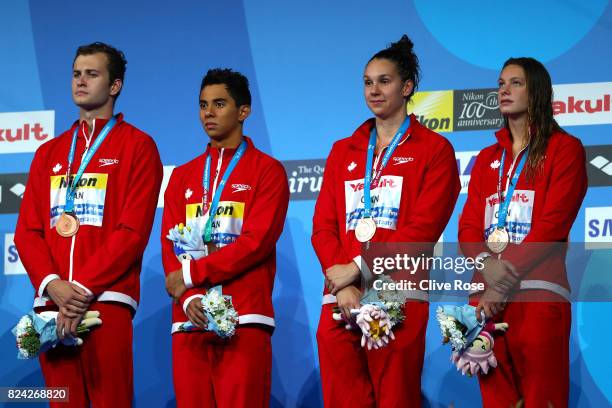 Bronze medalists Canada pose with the medals won during the Mixed 4x100m Freestyle final on day sixteen of the Budapest 2017 FINA World Championships...