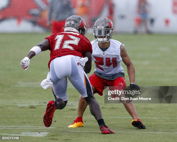 Cornerback Brent Grimes defends Wide Receiver Chris Godwin of the Tampa Bay Buccaneers during Training Camp at One Buc Place on July 29, 2017 in...