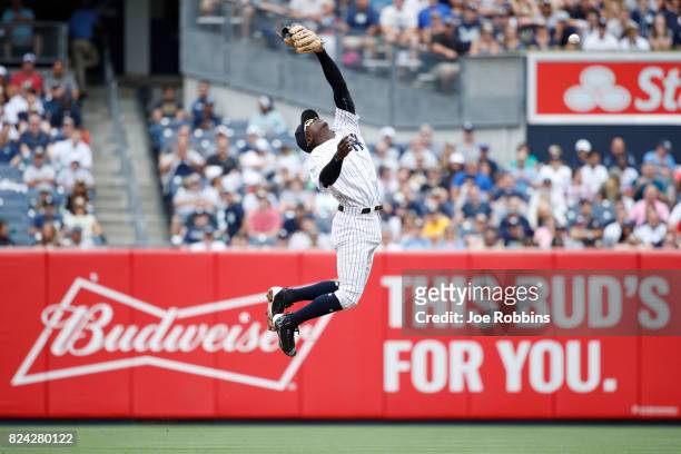 Didi Gregorius of the New York Yankees jumps but is unable to catch the ball in the third inning of a game against the Tampa Bay Rays at Yankee...