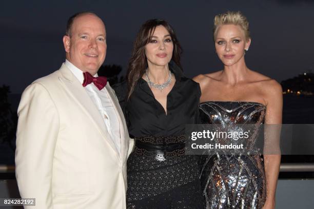 Prince Albert II of Monaco, Monika Bellucci and Princess Charlene of Monaco attend the 69th Monaco Red Cross Ball Gala at Sporting Monte-Carlo on...