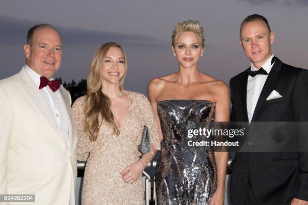 Prince Albert II of Monaco, Michelle Cound, Princess Charlene of Monaco and Christopher Froome attend the 69th Monaco Red Cross Ball Gala at Sporting...