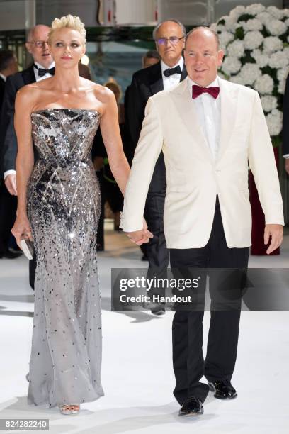 Princess Charlene of Monaco and Prince Albert II of Monaco attend the 69th Monaco Red Cross Ball Gala at Sporting Monte-Carlo on July 28, 2017 in...