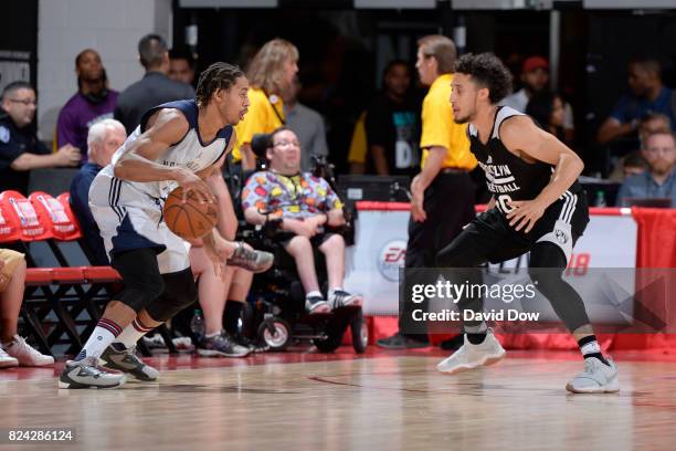 Isaiah Cousins of the New Orleans Pelicans handles the ball against Jeremy Senglin of the Brooklyn Nets during the 2017 Las Vegas Summer League on...