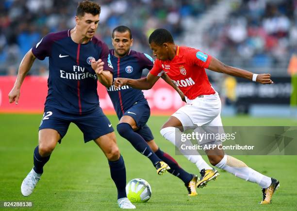 Monaco's French forward Kylian Mbappe vies for the ball with Paris Saint-Germain's Belgian defender Thomas Meunier and Paris Saint-Germain's...