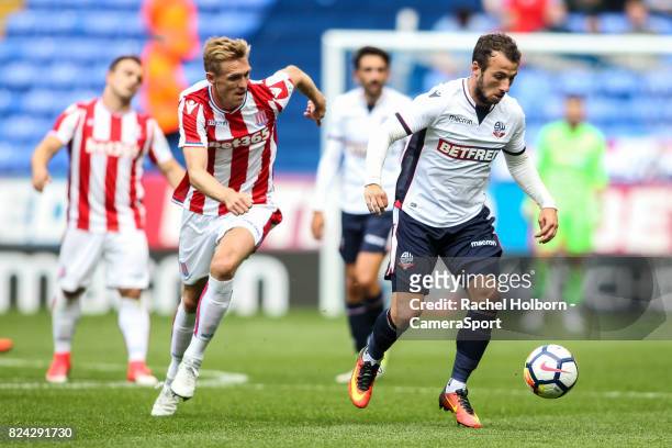 Bolton Wanderers' Adam Le Fondre gets away from Stoke City's Darren Fletcher during the pre-season friendly match between Bolton Wanderers and Stoke...