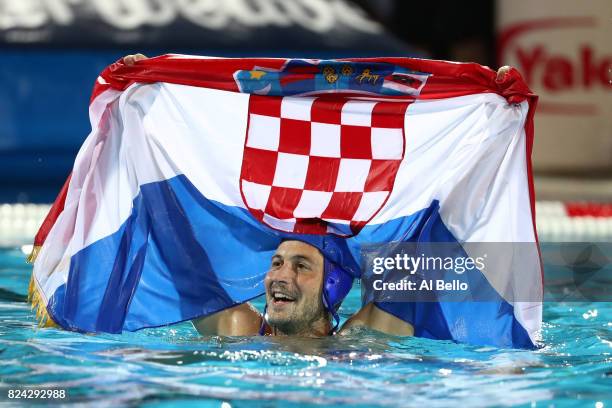 Andelo Setka of Croatia celebrates victory during the Men's Waterpolo Final between Hungary and Croatia on day sixteen of the Budapest 2017 FINA...