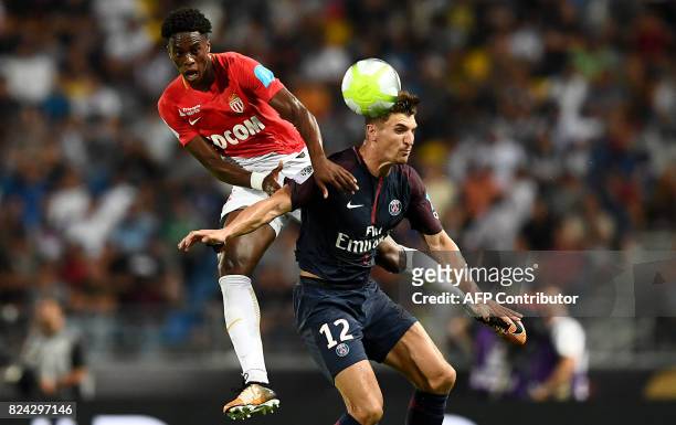Monaco's Swiss defender Terence Kongolo and Paris Saint-Germain's Belgian defender Thomas Meunier head the ball during the French Trophy of Champions...