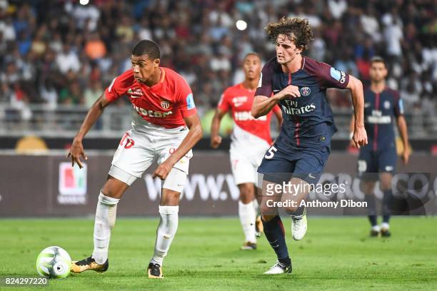 Kylian Mbappe of Monaco and Adrien Rabiot of PSG during the Champions Trophy match between Monaco and Paris Saint Germain at Stade Ibn-Batouta on...