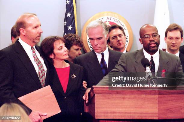 Prosecutor Christopher A Darden, with District Attorney Gil Garrett and Assistant DA Marcia Clark, speaks with reporters the day after OJ Simpson is...