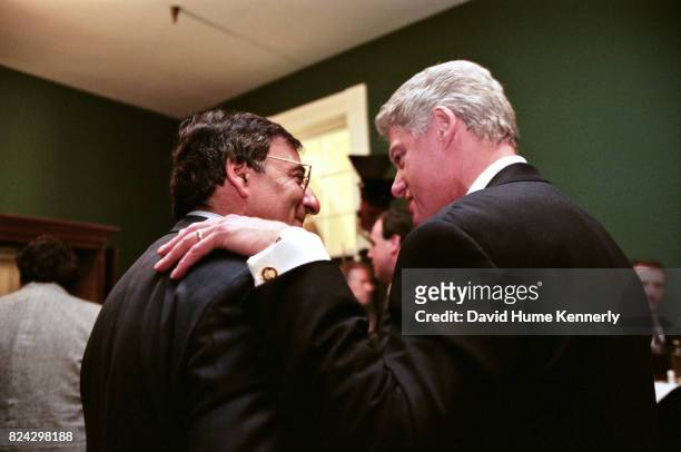 President Bill Clinton talks with White House Chief of Staff Leon Panetta on election night backstage at the Old State House, Little Rock, Arkansas,...
