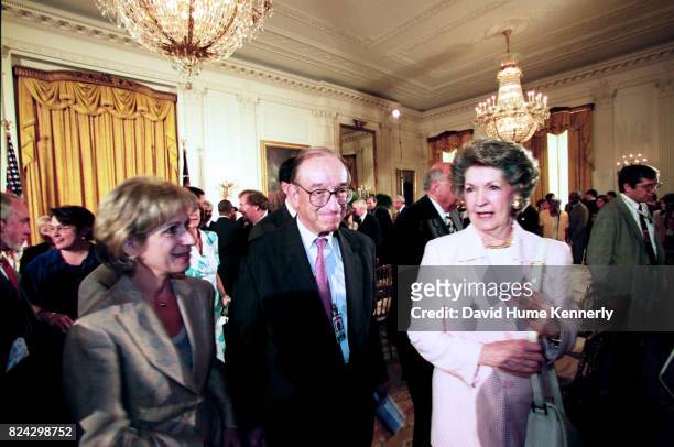 Chairman of the Federal Reserve, Alan Greenspan and his wife Andrea Mitchell a broadcast journalist, attending the ceremony awarding former President...