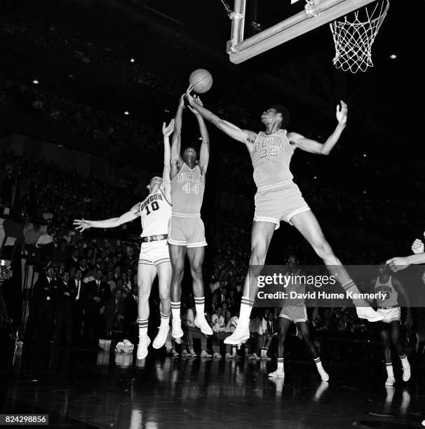 Lew Alcindor Jr jumps for a ball during a game between UCLA vs Oregon basketball game, Oregon, 1966.
