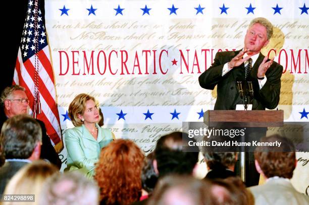 President Bill Clinton delivers a speech at the Democratic Business Leaders event, Washington DC, September 10, 1998. First Lady Hillary Clinton sits...