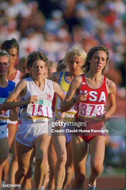 Zola Budd, barefoot runner, competes for Great Britain runs alongside USA's Mary Decker during the 3,000-meter women's track and field final at the...