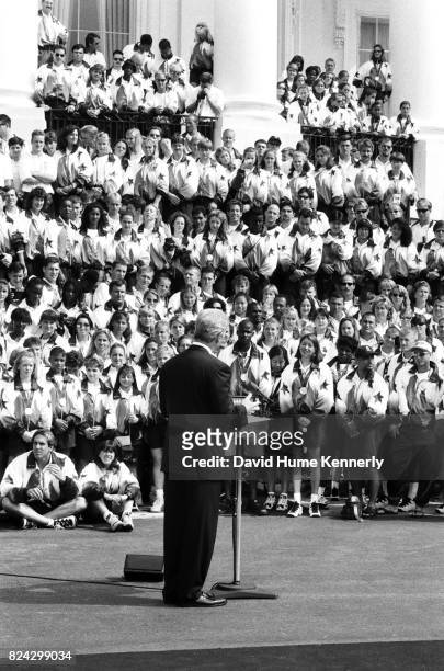 Members of the US Olympic Team listens to remarks from President Bill Clinton on the South Lawn of the White House before a group picture with the...