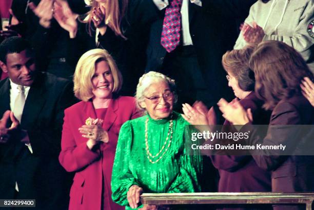 Civil Rights activist Rosa Parks stands as she is honored during President Bill Clinton's State of the Union Speech before a joint session of...