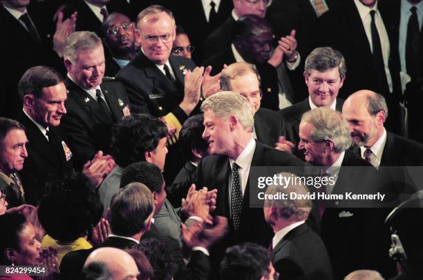 President Bill Clinton speaks with lawmakers following his State of the Union Speech before a joint session of Congress, Washington DC, January 19,...