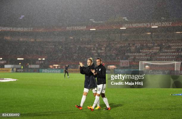Lena Petermann of Germany applauds the fans after the game was postponed due to heavy rain during the UEFA Women's Euro 2017 Quarter Final match...