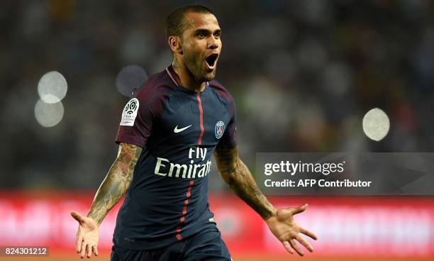 Paris Saint-Germain's Brazilian defender Dani Alves celebrates after scoring a goal during the French Trophy of Champions football match between...