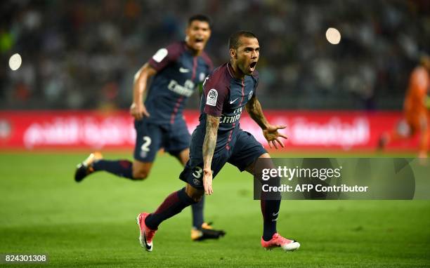 Paris Saint-Germain's Brazilian defender Dani Alves celebrates after scoring a goal during the French Trophy of Champions football match between...