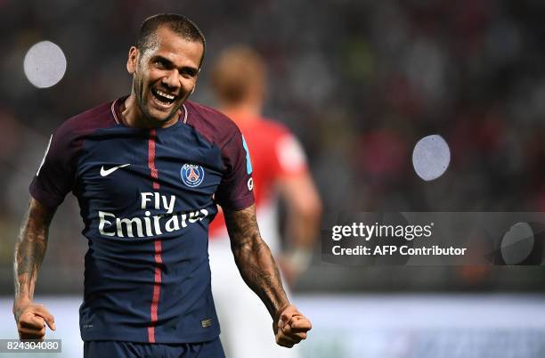 Paris Saint-Germain's Brazilian defender Dani Alves reacts after a goal of Paris Saint-Germain's French midfielder Adrien Rabiot during the French...