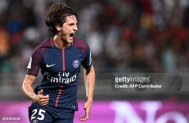 Paris Saint-Germain's French midfielder Adrien Rabiot celebrates after scoring a goal during the French Trophy of Champions football match between...